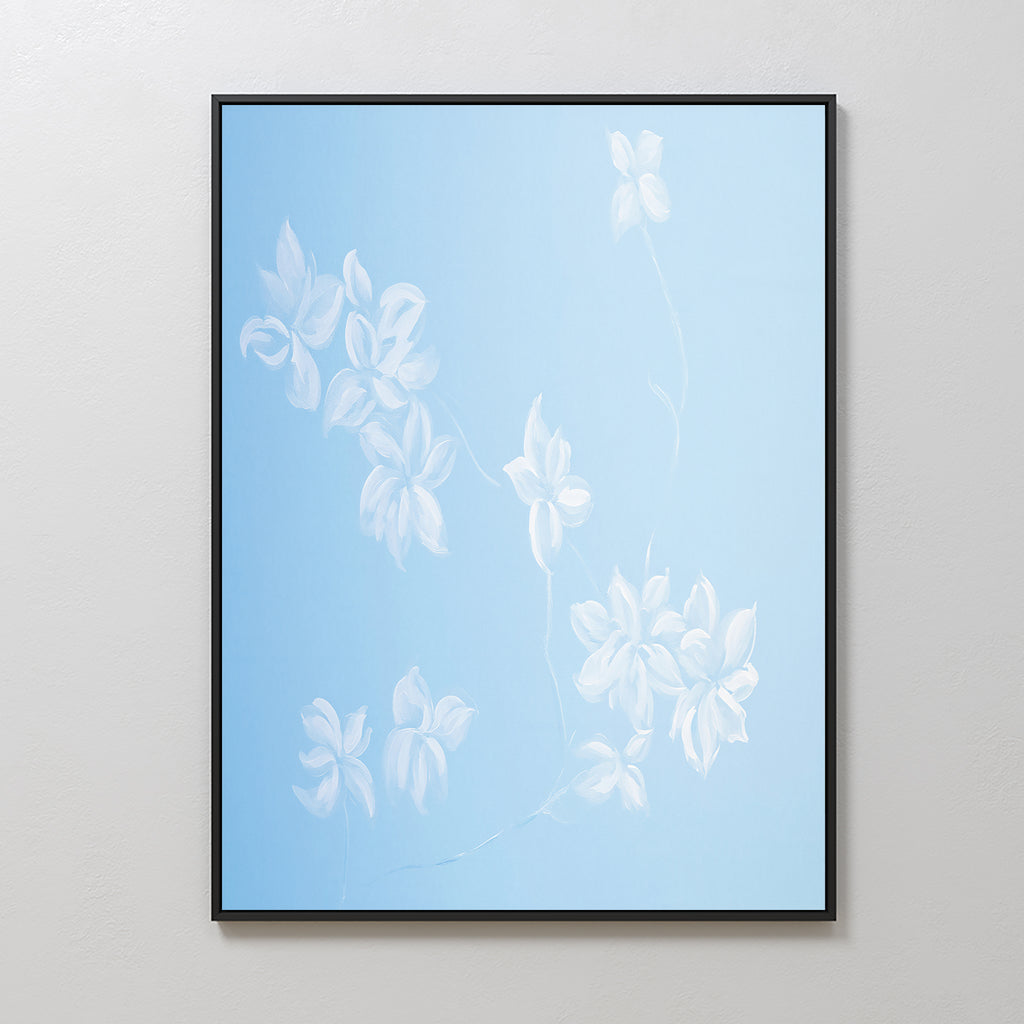 The Gentle Blossoms Canvas Art - Vertical features white flowers with delicate petals and stems on a soft powder blue gradient, adding elegant charm to any light-colored wall.
