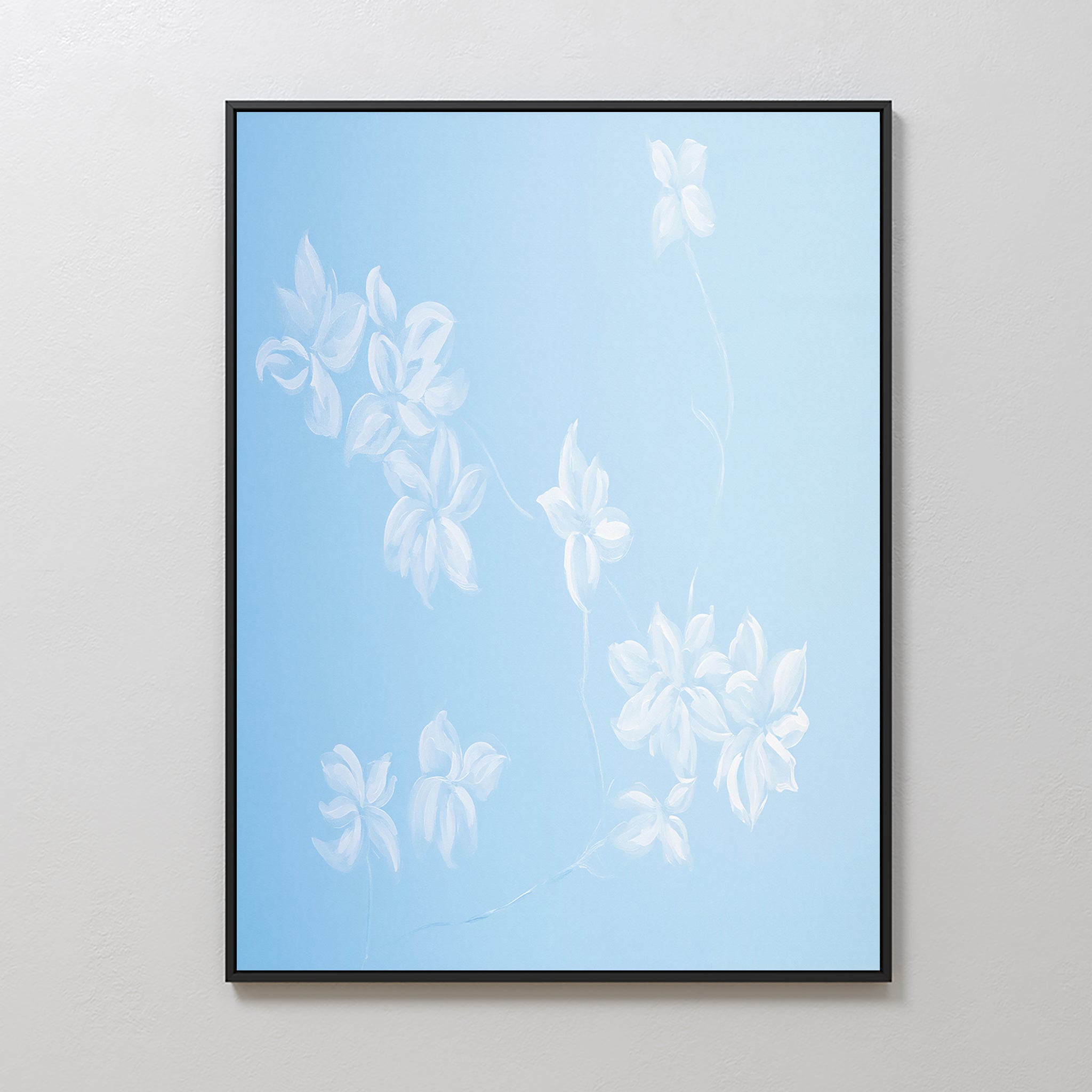 The Gentle Blossoms Canvas Art - Vertical features white flowers with delicate petals and stems on a soft powder blue gradient, adding elegant charm to any light-colored wall.