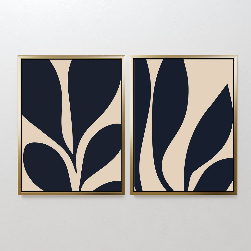 The Botanical Ink Set of 2 features framed abstract prints with bold navy shapes on beige, adding modern decor and organic, botanical style to any white wall.