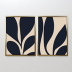 The Botanical Ink Set of 2 features framed abstract prints with bold navy shapes on beige, adding modern decor and organic, botanical style to any white wall.