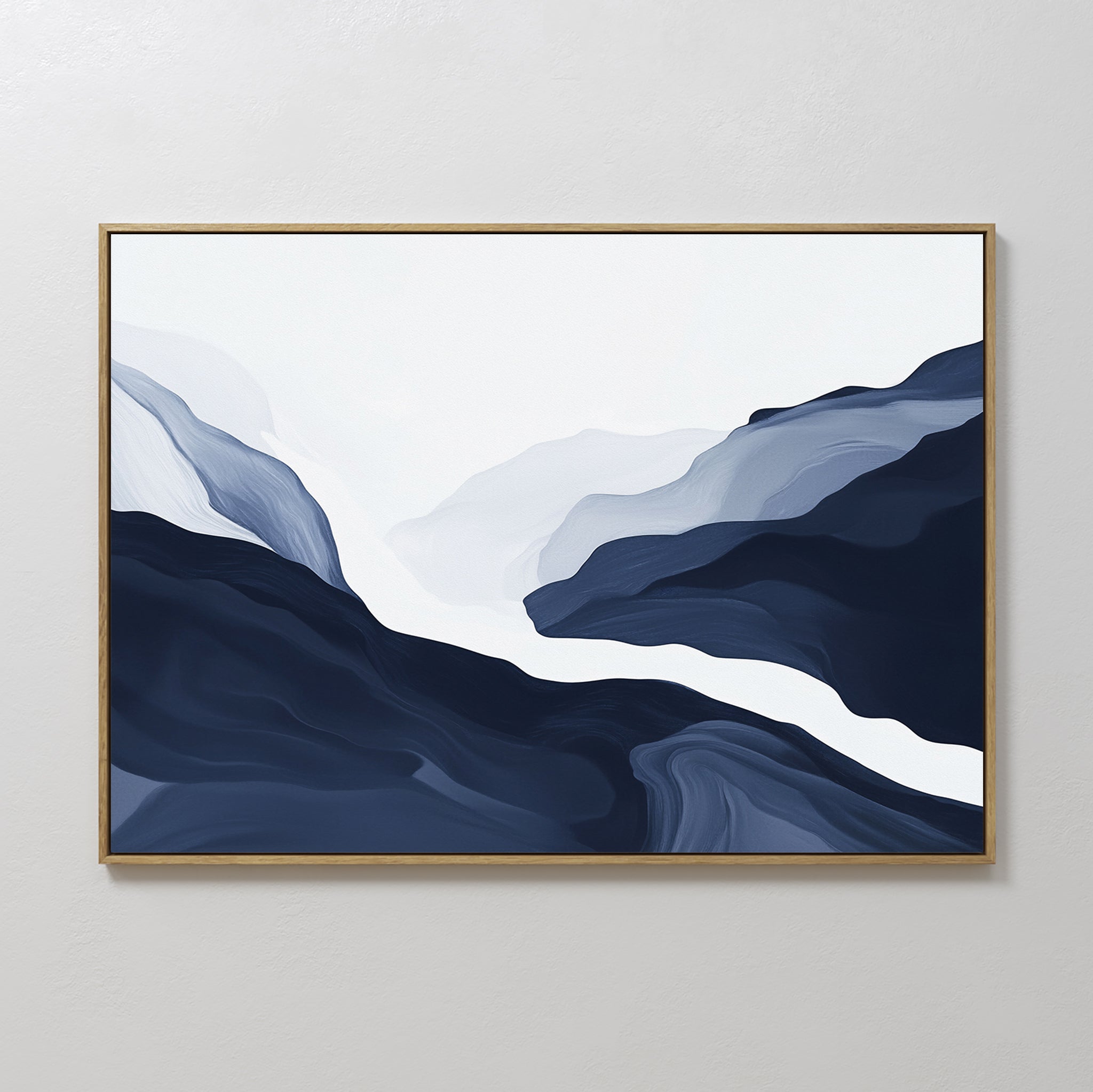Glacier Flow Canvas Art - Horizontal features abstract mountains in blue, gray, and white with fluid, layered shapes suggesting a valley. Framed and ideal for modern home decor, it looks stunning on any light-colored wall.