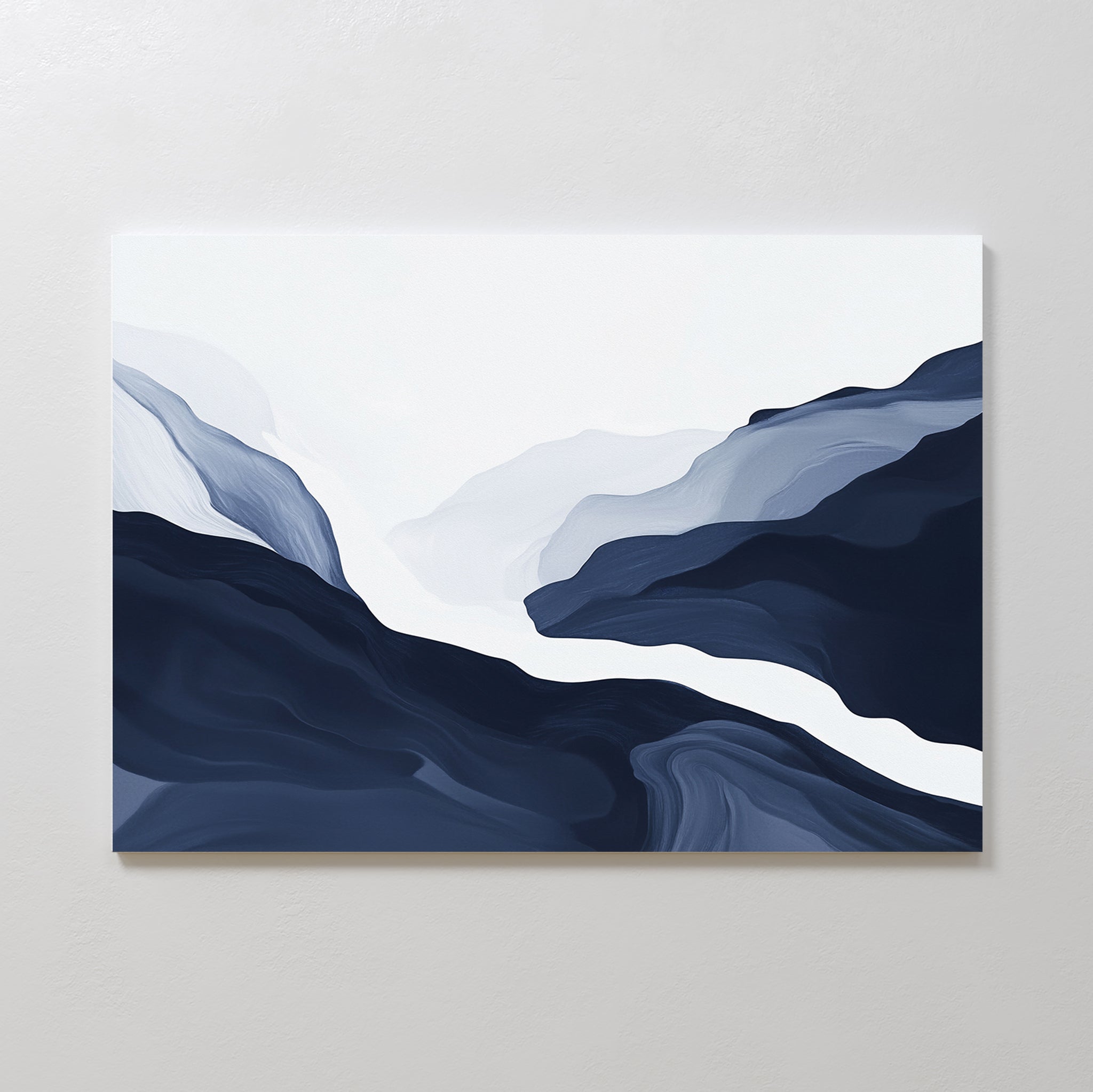The Glacier Flow Canvas Art - Horizontal features abstract fluid shapes in blue, gray, and white, resembling mountains or waves with a misty center—ideal navy wall art for modern decor on light-colored walls.