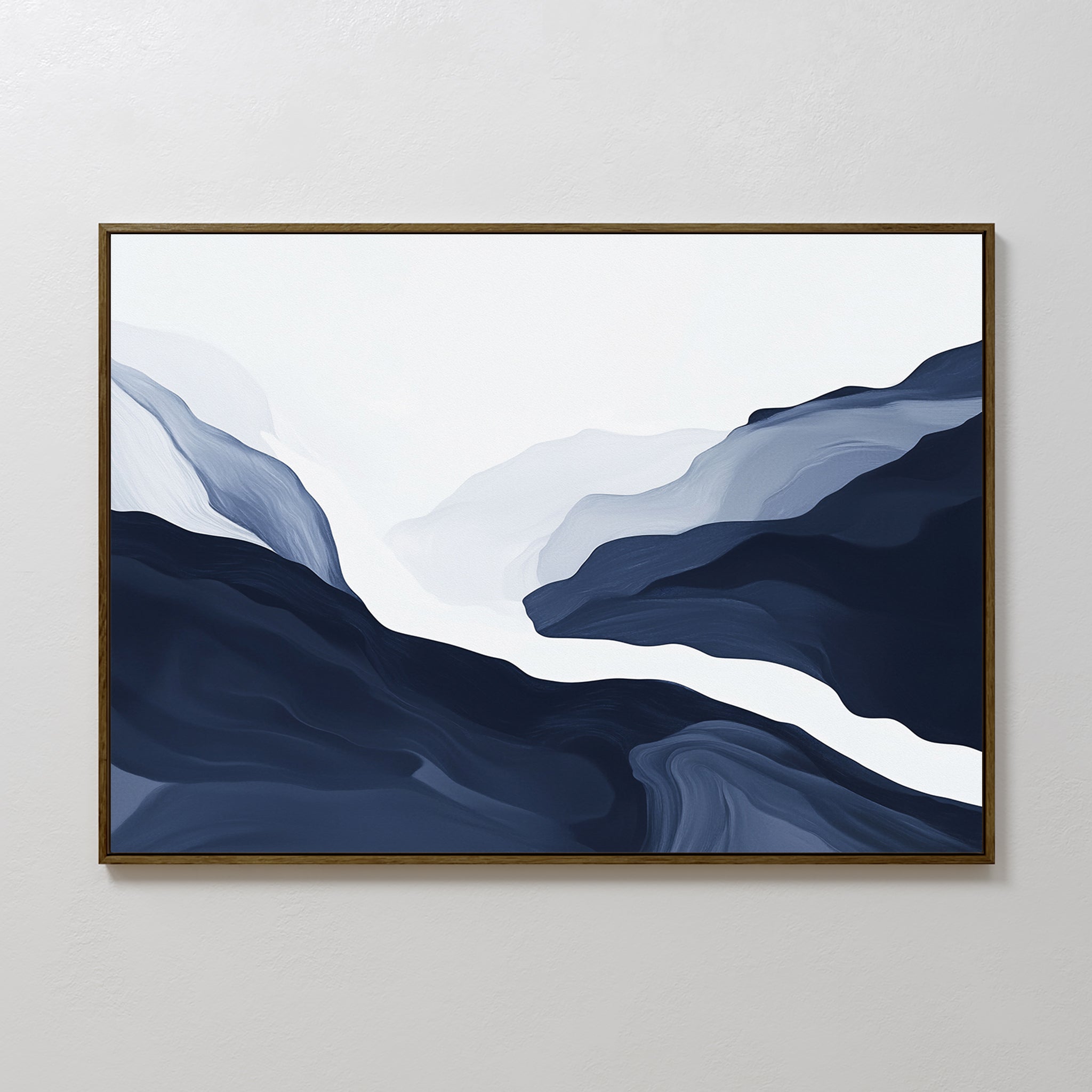 Glacier Flow Canvas Art - Horizontal features minimalist mountains in blue and white with soft, flowing lines and a misty effect. Displayed on a plain, light wall, it comes framed in a thin, dark frame for modern home decor.