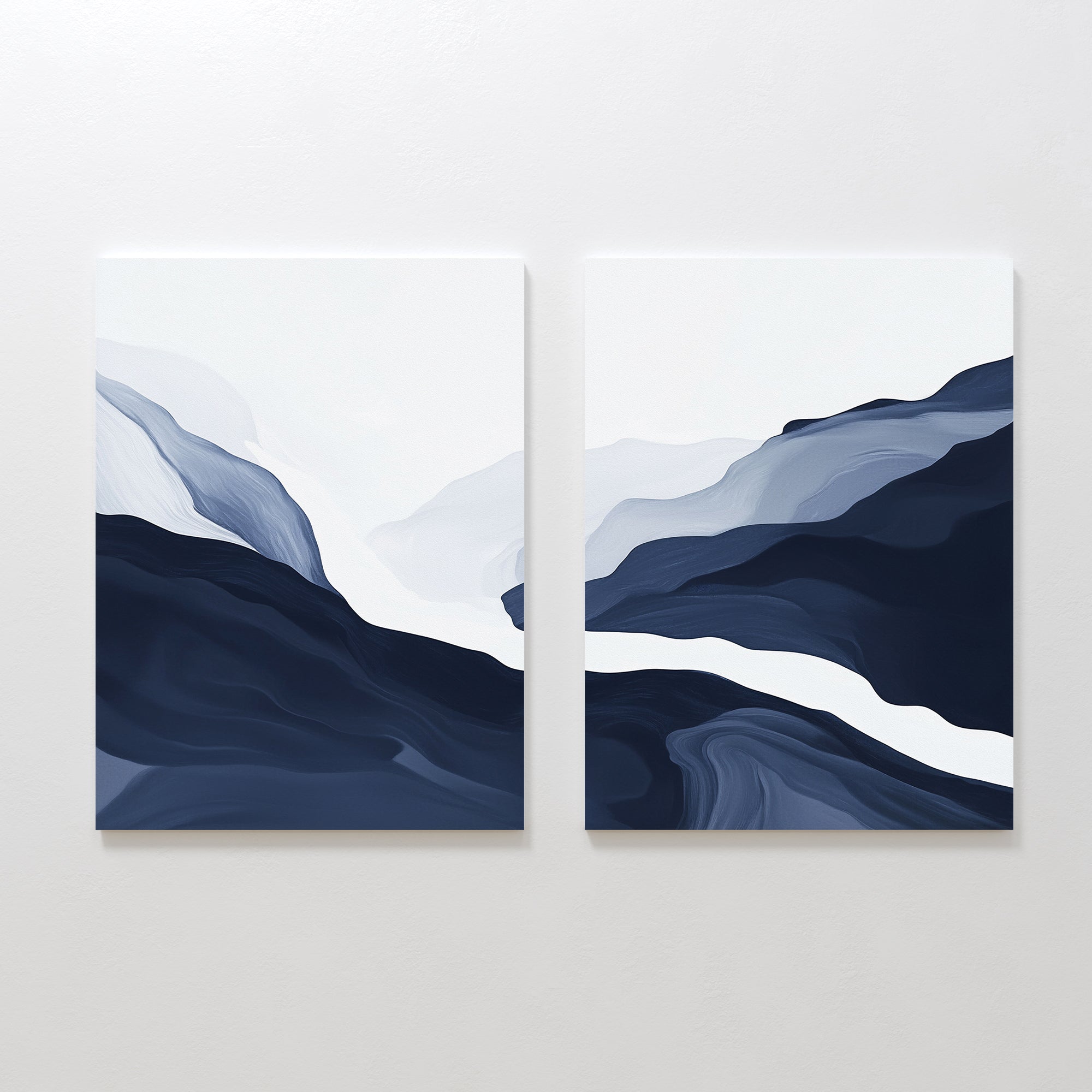 Glacier Flow - Set Of 2: Modern abstract wall art featuring layered shapes in blue, gray, and white tones, evoking mountains or waves on a plain white background—perfect for Nordic decor.