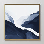 The Glacier Flow Canvas Art - Square features abstract, layered shapes in deep blue, gray, and white within a wooden frame, evoking mountain or river landscapes. This modern piece adds a sophisticated touch to any light-colored wall.