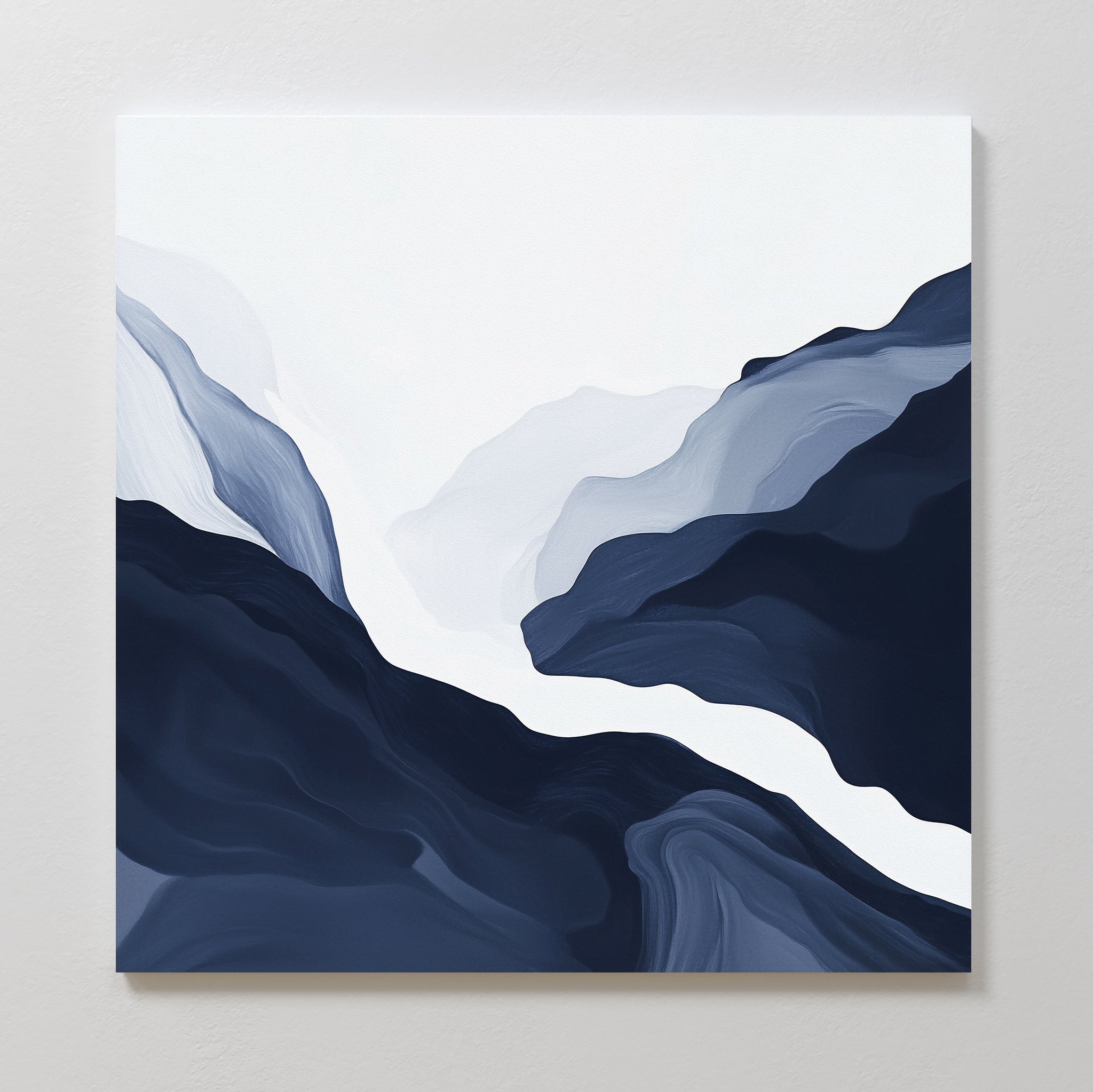 The Glacier Flow Canvas Art - Square features flowing, layered shapes in navy blue, gray, and white, evoking misty mountains or a winding river—an ideal choice for modern wall decor.