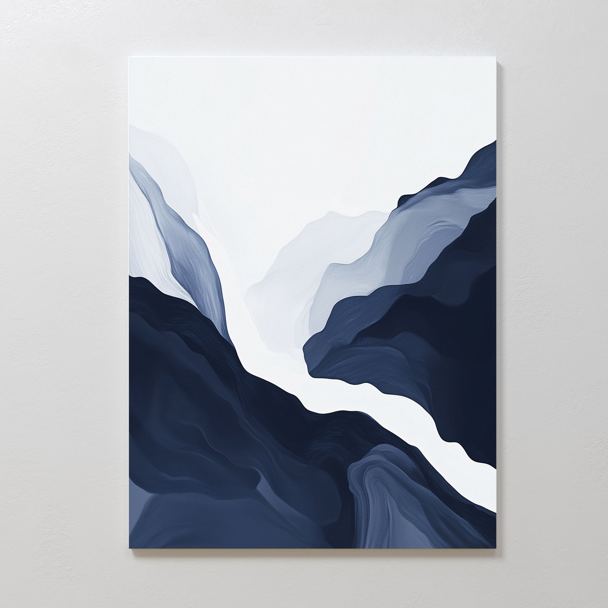 The Glacier Flow Canvas Art - Vertical features flowing, layered shapes in navy blue, gray, and white, creating a stylized landscape. Ideal as navy blue wall art for modern home decor on a plain light wall.