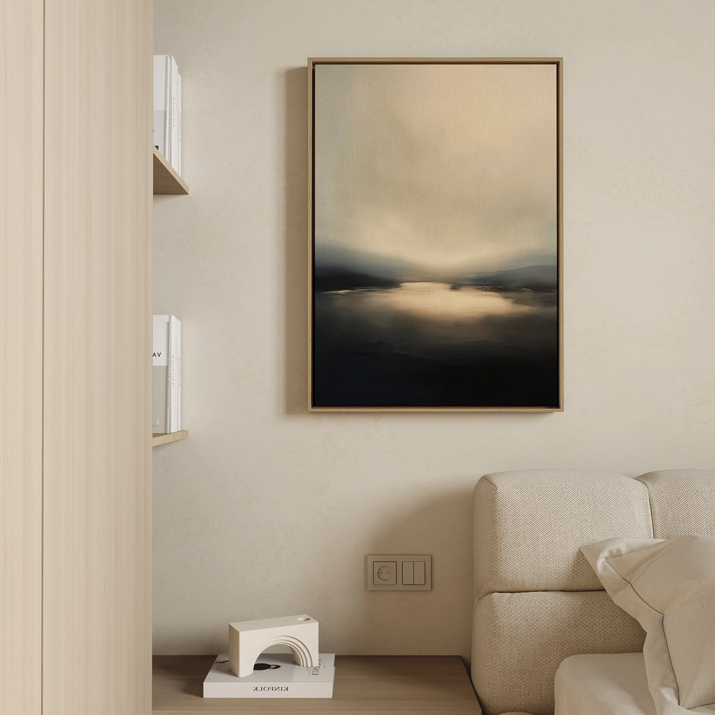 Minimalist living room with a beige sofa, light wood wall and shelves, a small geometric sculpture, and the Golden Fog Horizon Canvas Art - Vertical in soft beige and dark tones hanging above the couch.