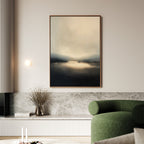 A modern living room with a green curved sofa, marble-topped low cabinet, glass vase with dried flowers, and the Golden Fog Horizon Canvas Art - Vertical in neutral tones hanging on the wall.