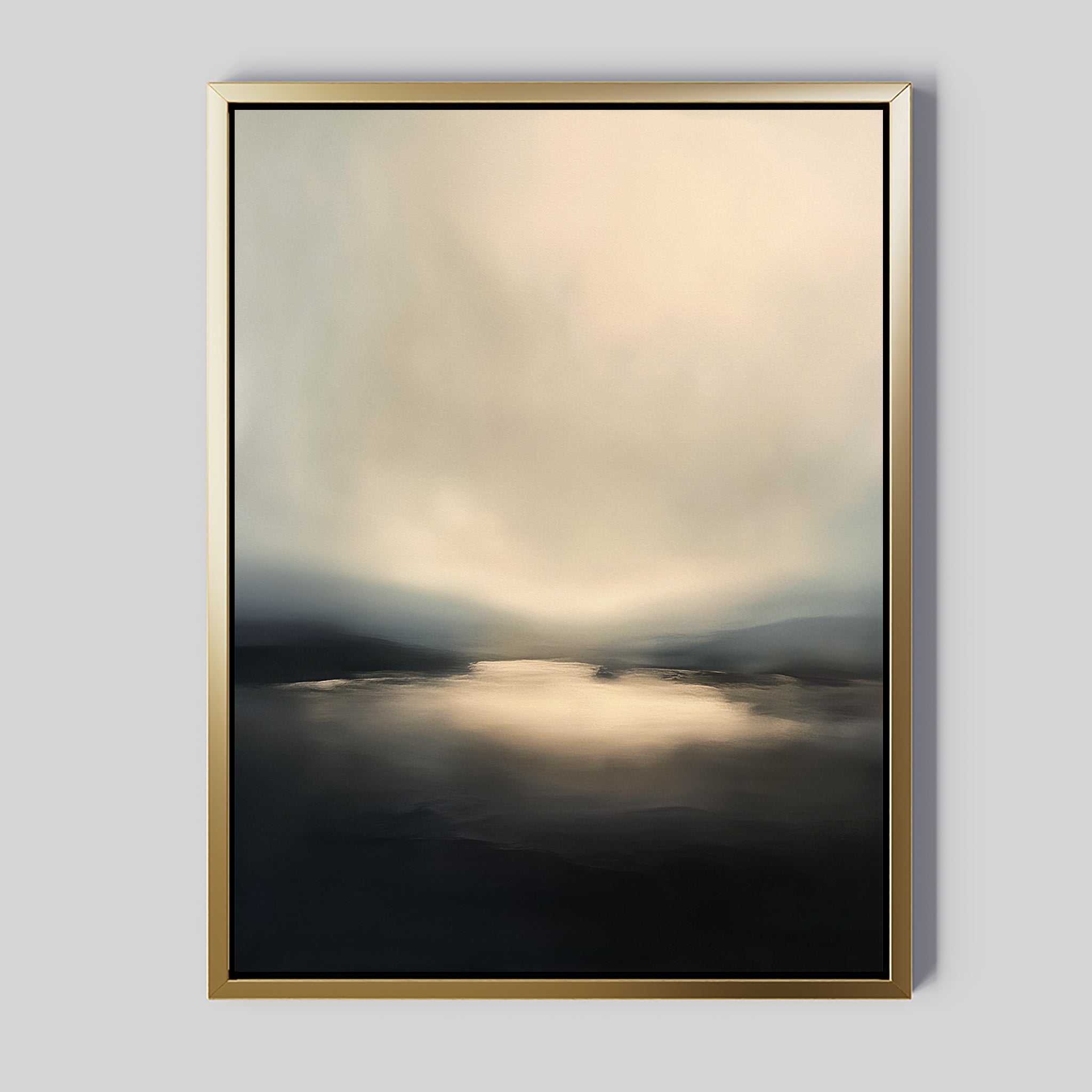 The Golden Fog Horizon Canvas Art - Vertical features a tranquil landscape with soft, blurred beige, gray, and black tones. A reflective body of water beneath a cloudy sky is elegantly highlighted by a gold frame against the light gray background.