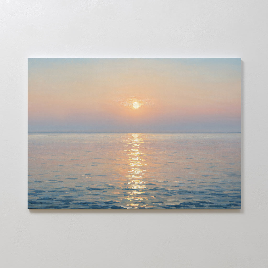The Golden Reflection Canvas Art - Horizontal features a tranquil ocean at sunrise or sunset, with pastel hues and the sun’s glow on gentle waves, adding serene charm to any plain white wall.