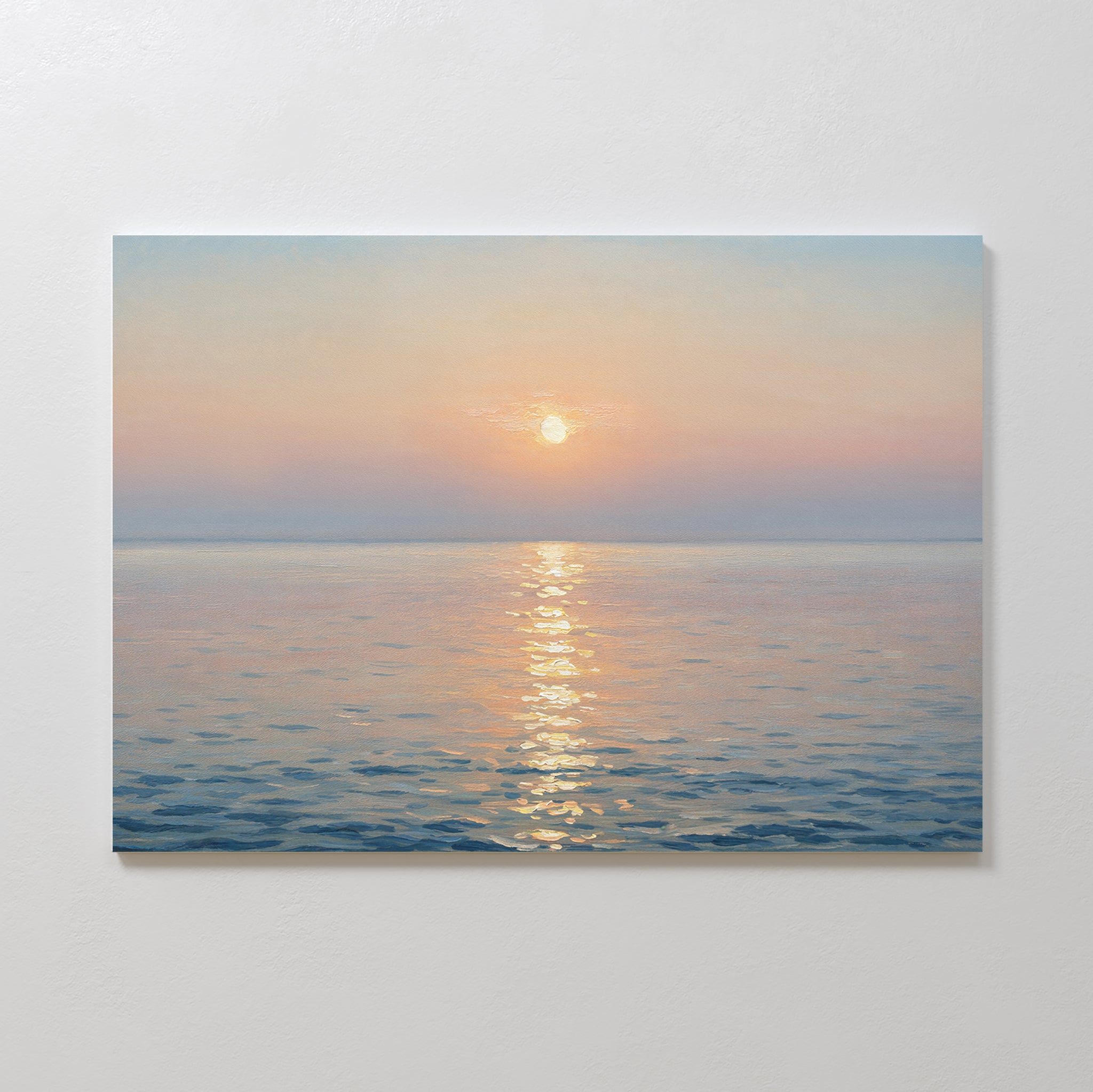 The Golden Reflection Canvas Art - Horizontal features a tranquil ocean at sunrise or sunset, with pastel hues and the sun’s glow on gentle waves, adding serene charm to any plain white wall.