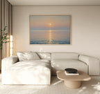 A minimalist living room featuring a light beige sectional sofa, wooden coffee table, potted plant, and tranquil decor is completed by the Golden Reflection Canvas Art - Horizontal displayed above the sofa.