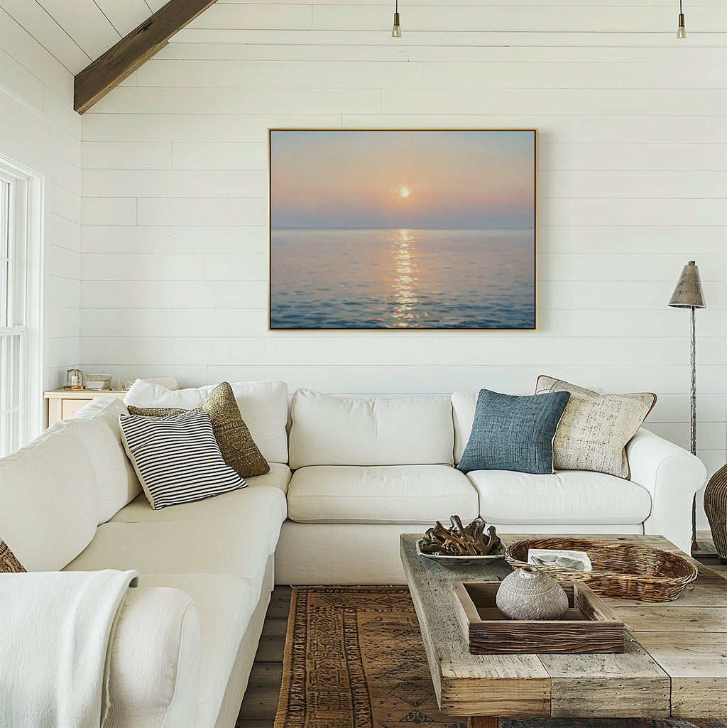 A cozy, sunlit living room with white shiplap walls, a white sectional sofa, assorted throw pillows, a rustic wooden coffee table, and the Golden Reflection Canvas Art - Horizontal framed above the couch.