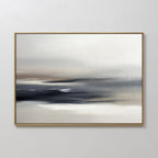 Grey Ripples Canvas Art - Horizontal features a minimalist, misty landscape with soft blends of white, gray, black, and brown. Set in a slim light frame on a white wall, it’s the perfect modern accent for your living room.