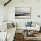 A bright, cozy living room with white shiplap walls, a white sectional sofa, assorted pillows, a rustic wooden coffee table, and the Grey Ripples Canvas Art - Horizontal hanging above the sofa—perfect for modern living room lovers.