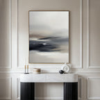 A minimalist console table with a marble top displays modern decor, while the Grey Ripples Canvas Art - Vertical hangs above on an elegant paneled wall—creating a perfect focal point for contemporary living rooms.