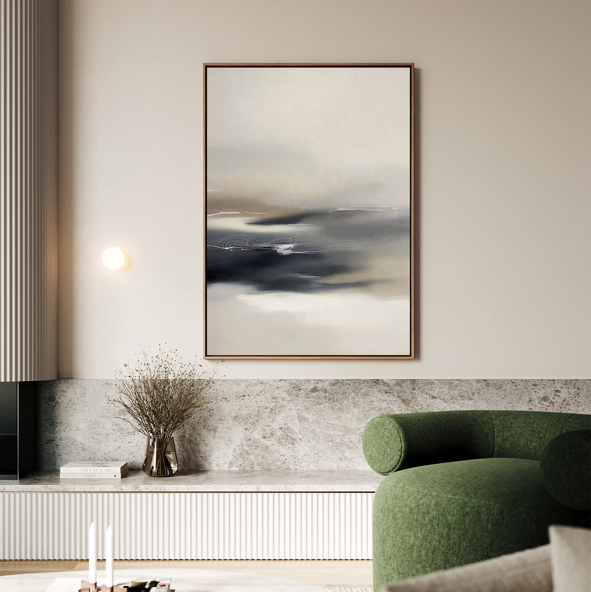 A modern living room features the Grey Ripples Canvas Art - Vertical on the wall, a marble surface with a vase of dried branches below, and a green curved armchair. Neutral tones and soft lighting add to the calm ambiance.
