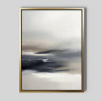 The Grey Ripples Canvas Art - Vertical features soft, blended shades of white, gray, and black with wispy brushstrokes. This framed abstract piece adds a modern minimalist touch to living rooms, especially against a light gray wall.
