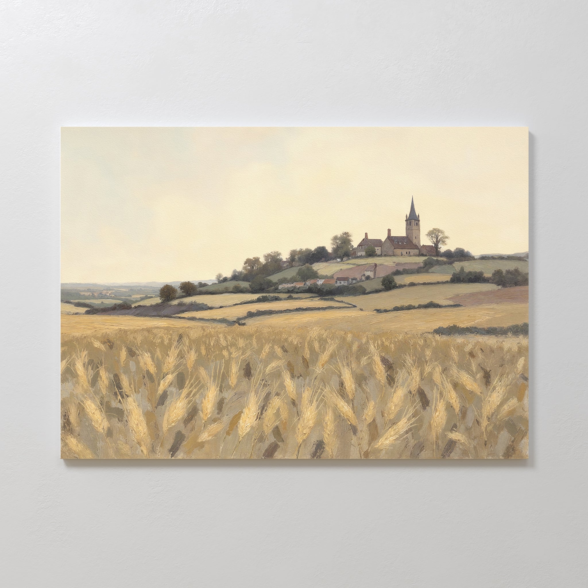 The Harvest Chapel Canvas Art - Horizontal features a golden wheat field with rolling hills, trees, and a church steeple under a pale sky—ideal rustic wall art to enhance any pastoral home decor.