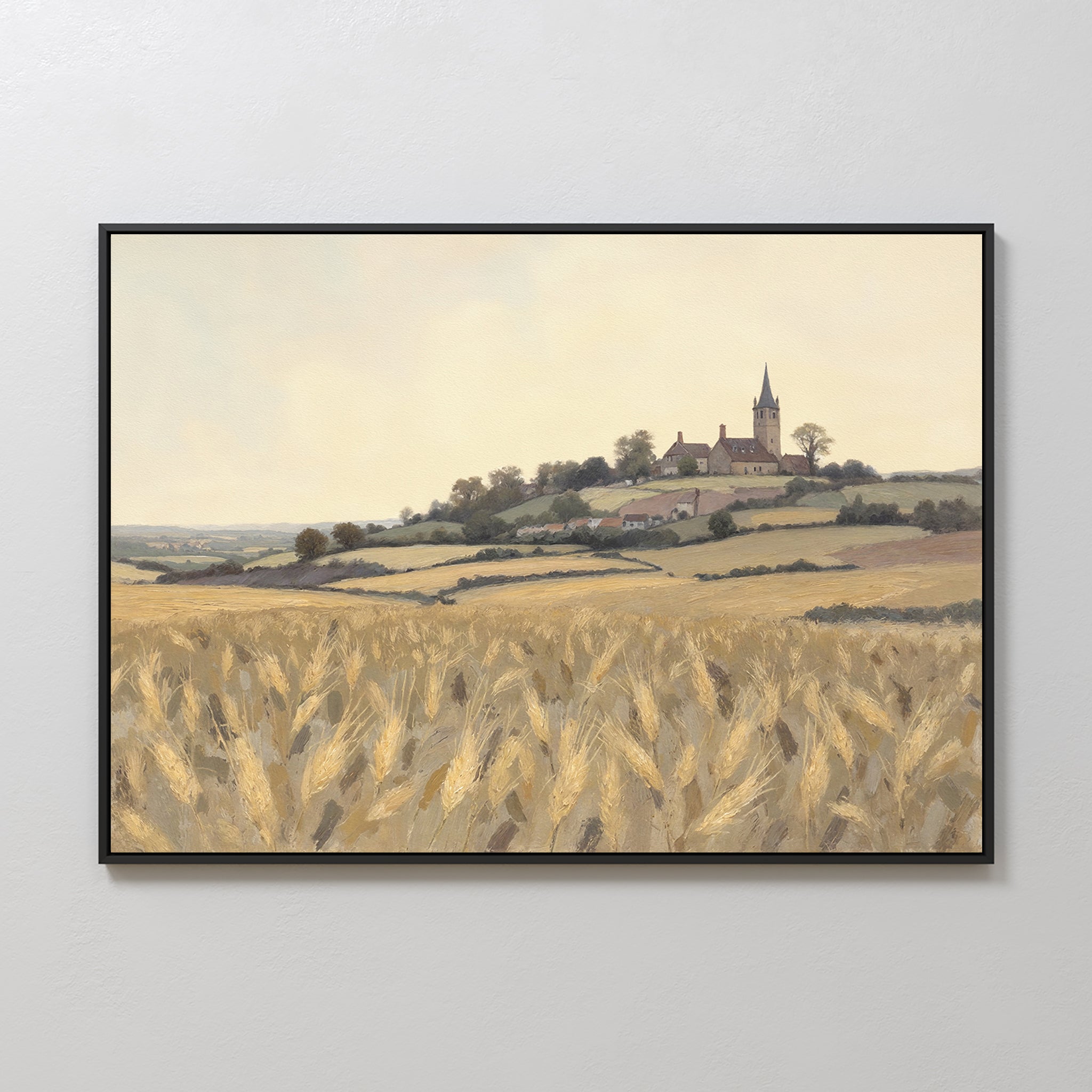 Harvest Chapel Canvas Art - Horizontal: A framed rural landscape print with golden wheat fields and a hilltop chapel beneath a hazy sky—ideal as pastoral home decor or rustic wall art.