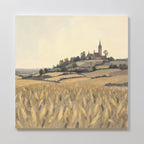Harvest Chapel Canvas Art - Square: A golden wheat field leads to rolling hills, trees, and the charming Harvest Chapel with its steeple nestled in a quaint village under a soft, cloudy sky.