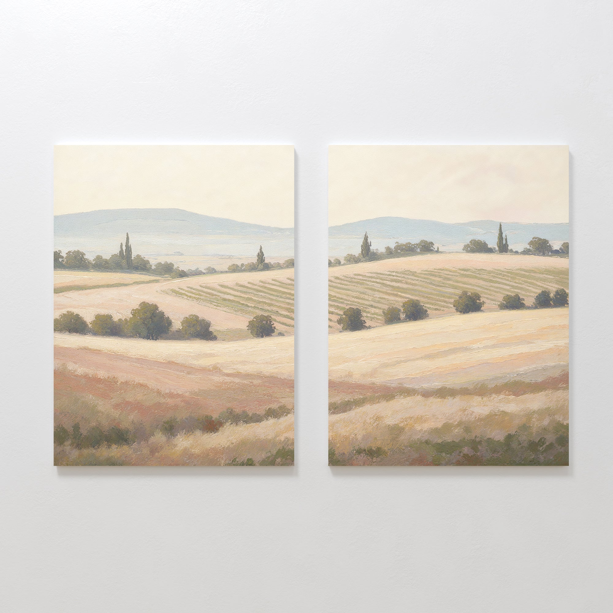 Harvest Fields - Set of 2 features two canvas paintings of serene countryside landscapes with rolling hills and golden fields, offering peaceful farmhouse decor in soft, muted colors for a tranquil home atmosphere.