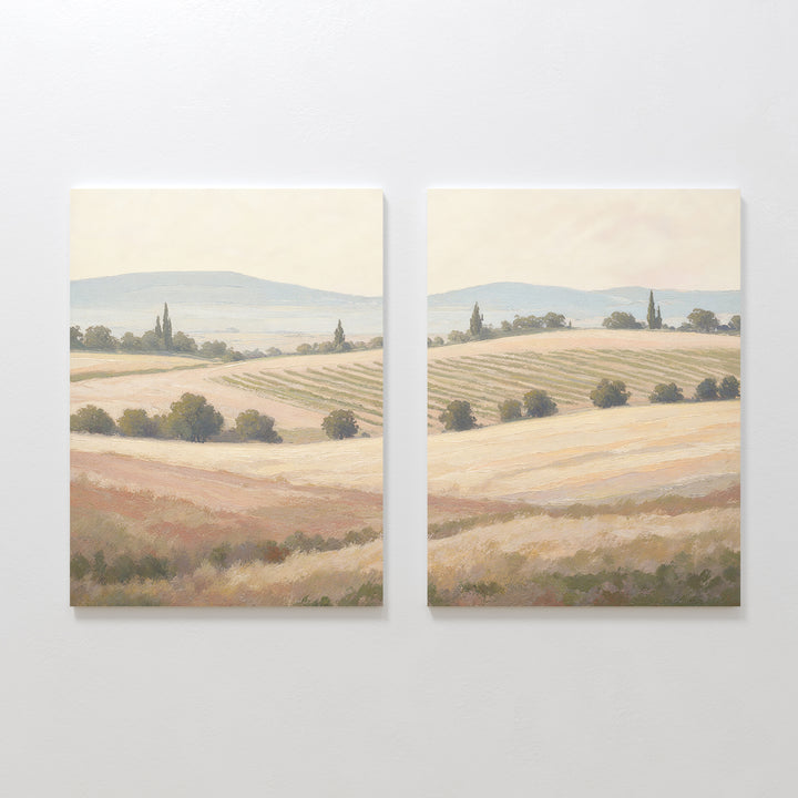 Harvest Fields - Set of 2 features two canvas paintings of serene countryside landscapes with rolling hills and golden fields, offering peaceful farmhouse decor in soft, muted colors for a tranquil home atmosphere.
