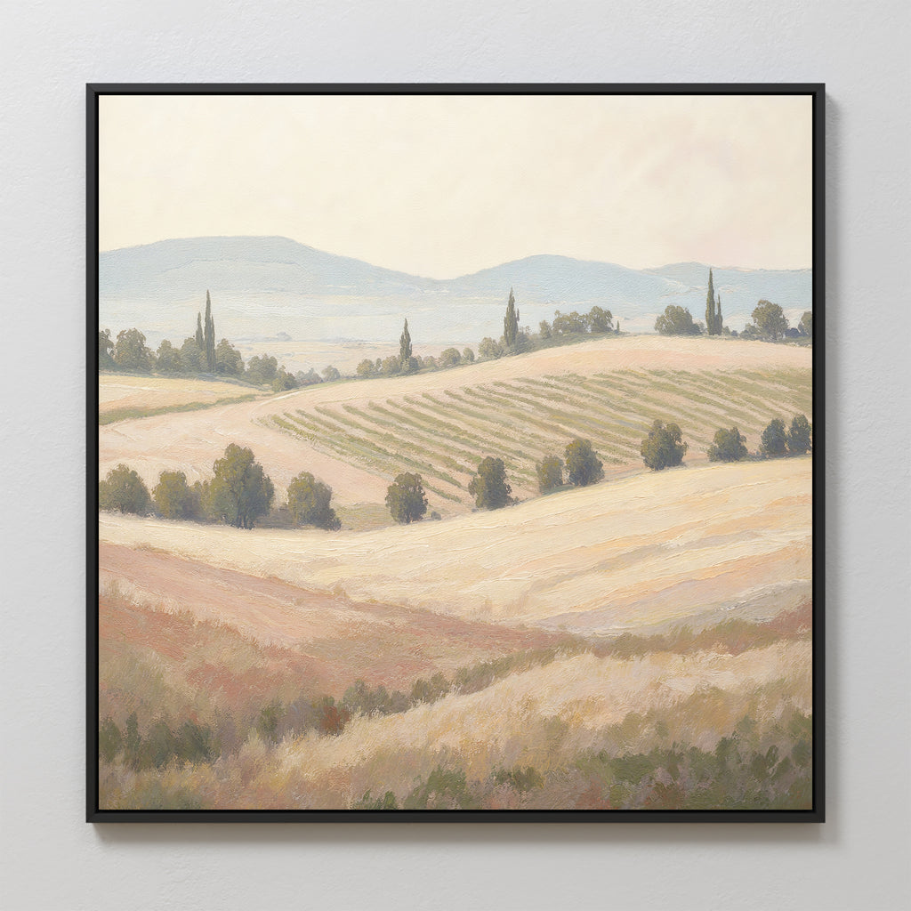 The "Harvest Fields Canvas Art - Square" is a framed print showcasing a sunlit landscape with rolling hills, light brown and green fields, rows of crops, scattered trees, and distant mountains under a soft sky.
