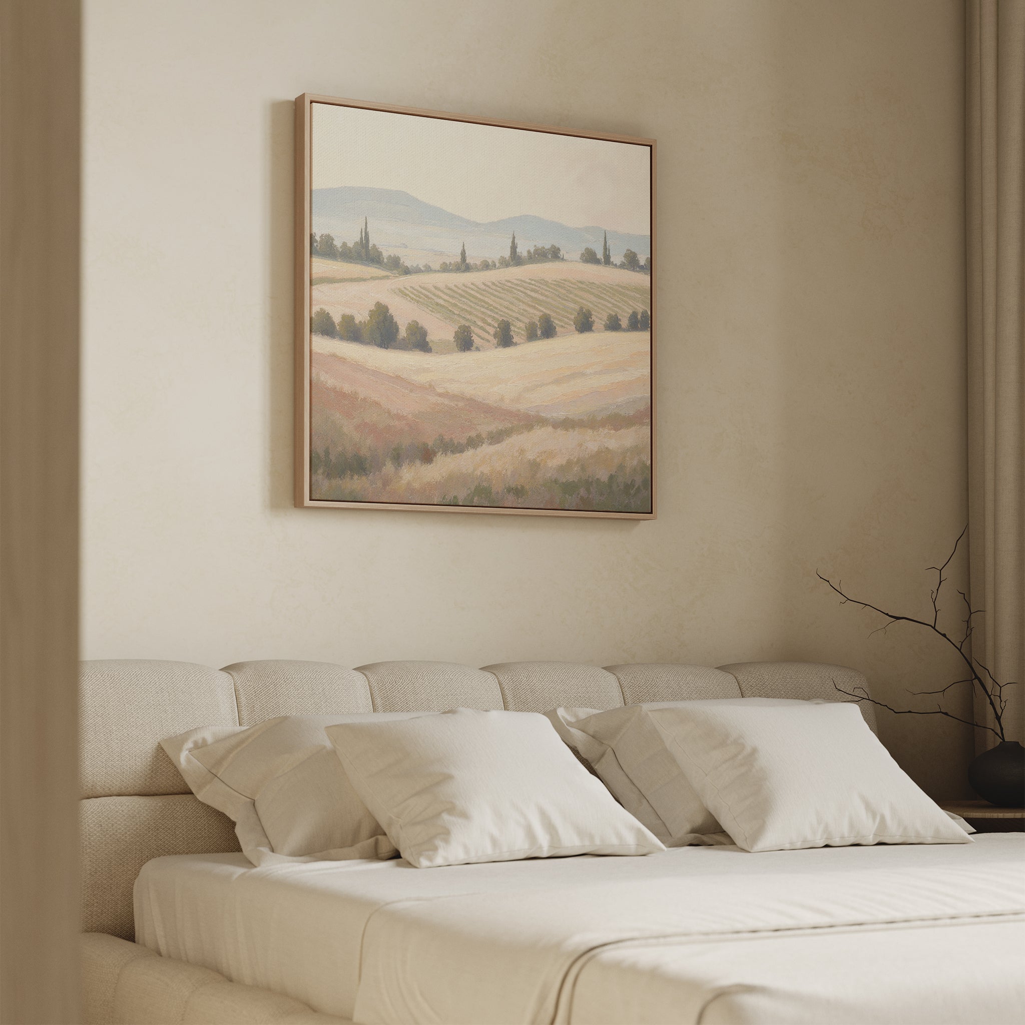 A cozy beige bedroom features a soft bed, white pillows, minimalist branch decor, and the Harvest Fields Canvas Art - Square above the headboard for a serene countryside touch.