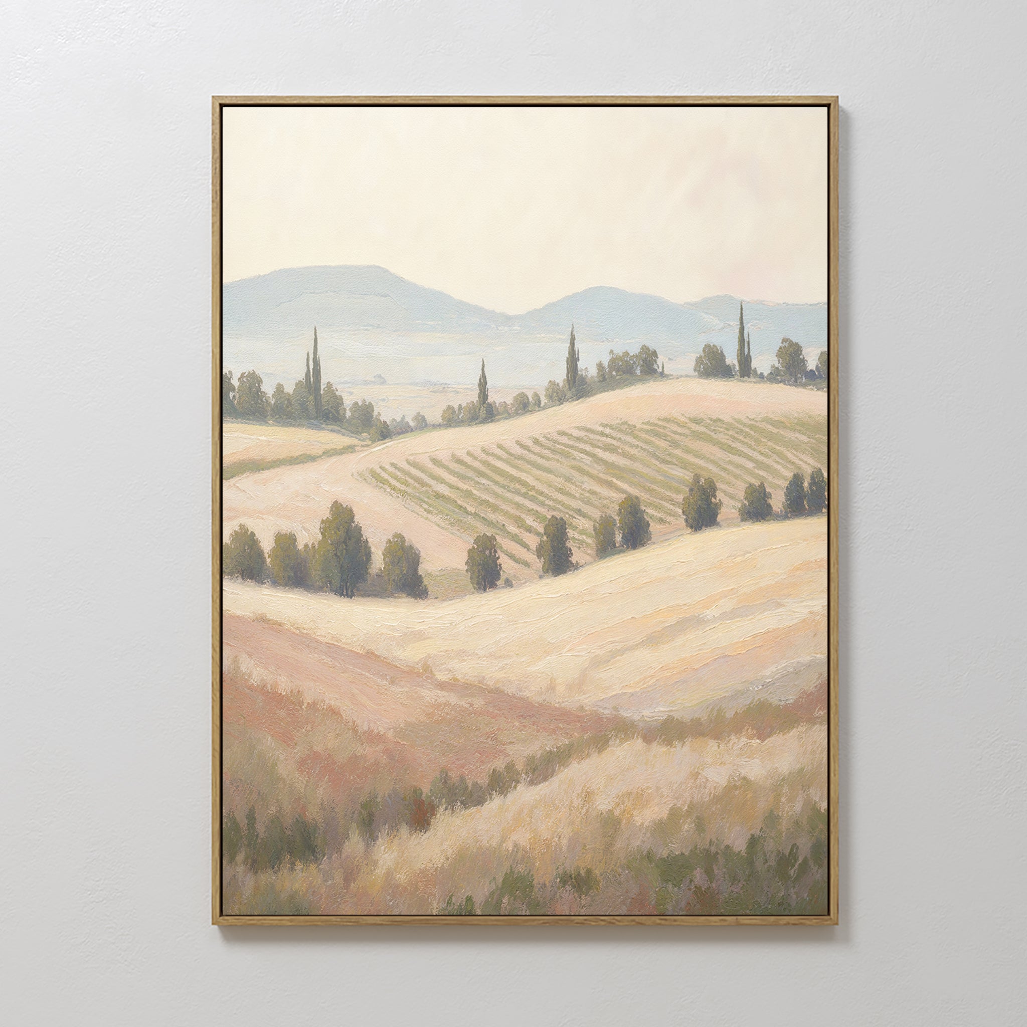 Harvest Fields Canvas Art - Vertical features rolling fields, tree lines, and distant hills beneath a hazy sky. Muted earthy tones create a calm, serene atmosphere—ideal wall art for tranquil home décor.