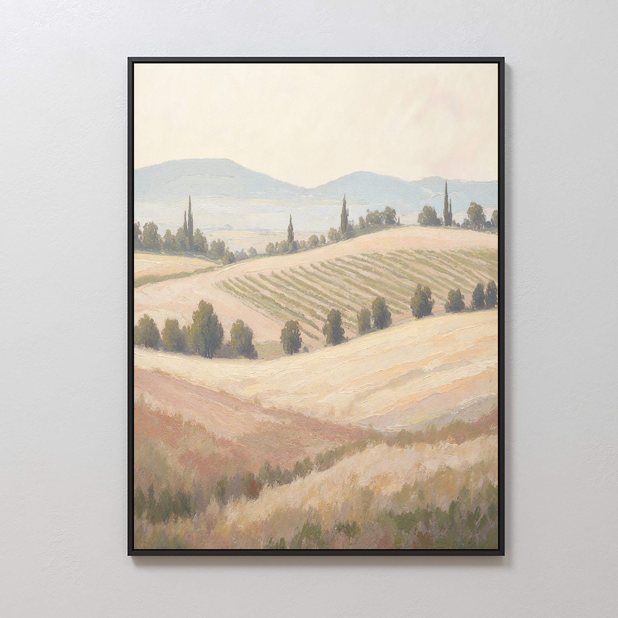 Add tranquility to your home with the Harvest Fields Canvas Art - Vertical, featuring a framed countryside landscape of rolling hills, scattered trees, and distant mountains in soft earth tones—a perfect piece for serene decor.