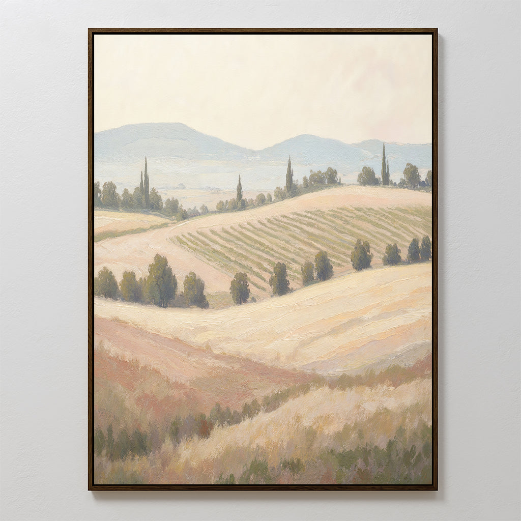 Harvest Fields Canvas Art - Vertical: A framed painting featuring rolling hills, golden fields, tree lines, and distant blue mountains under a hazy sky—perfect for adding serene charm to your home decor.