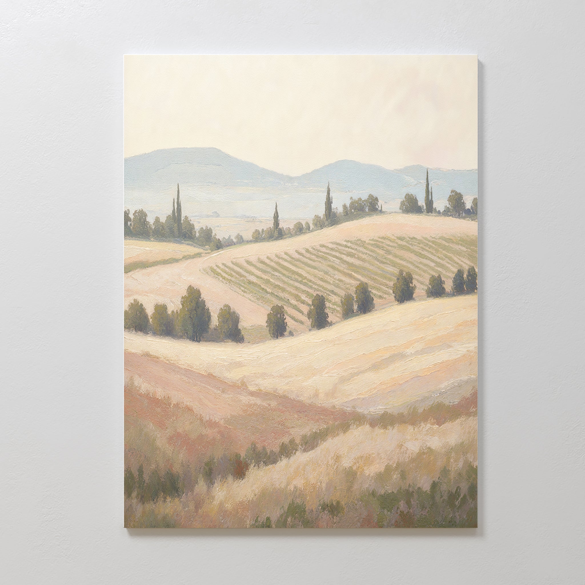 The Harvest Fields Canvas Art - Vertical showcases rolling hills, scattered trees, and distant mountains under a pale sky—ideal pastoral wall art for tranquil, serene home decor.