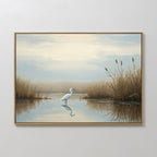 Heron's Morning Canvas Art - Horizontal features a white heron standing in shallow water amid tall brown grasses, with a soft cloudy sky above—a serene wall art piece in muted blues, creams, and browns.