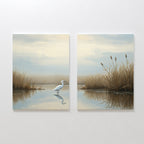Heron's Morning - Set Of 2 features canvas prints: one with a white egret standing in calm water, the other with tall grasses and gentle sky reflections—ideal wall art for creating a serene atmosphere.