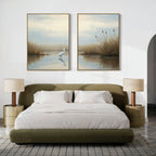A modern bedroom with an olive-green bed, white bedding, two beige nightstands with matching lamps, and the "Heron's Morning - Set Of 2" wall art above the bed depicting a white egret and a wetland scene.