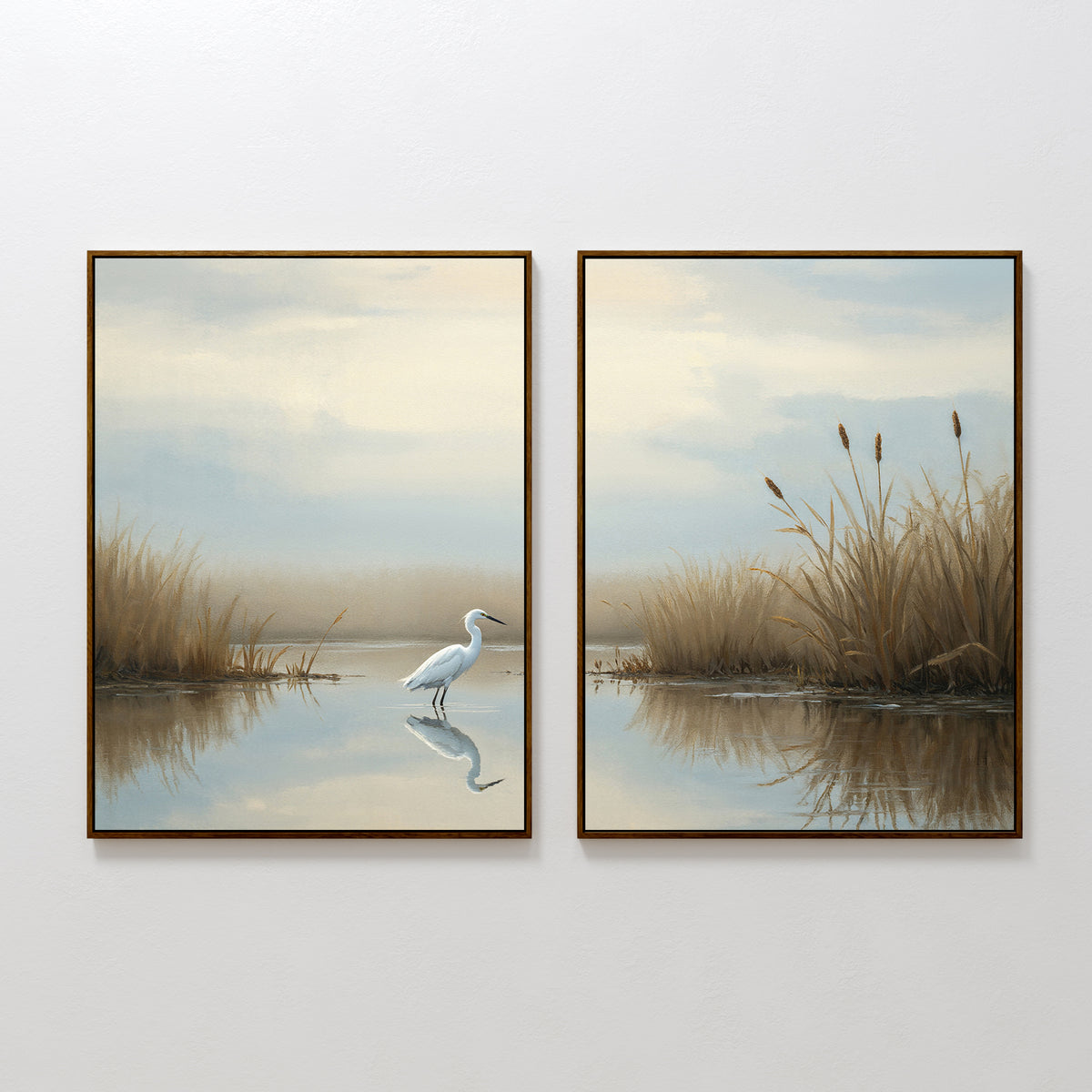 The Heron's Morning - Set Of 2 features framed wall art prints of a tranquil wetland with tall grasses and still water; the left piece highlights a white egret, while both display calm reflections under a soft, cloudy sky.