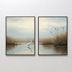 Heron's Morning - Set of 2: Framed wall art prints depicting a serene wetland with tall grasses, calm water, and a white egret by the shore, shown on a plain white wall.