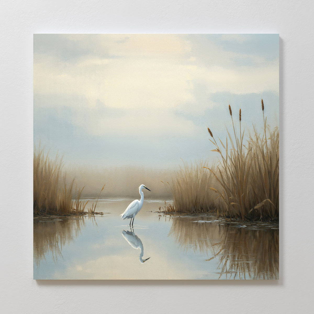 The Heron's Morning Canvas Art - Square features a white egret standing in shallow water among tall grasses and cattails, with its reflection shimmering on the calm surface in soft, muted colors.