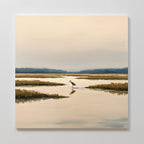 The Marsh Bird Canvas Art - Square features a peaceful marsh landscape at dawn, with calm water, grassy patches, a lone bird, and a soft overcast sky that creates a serene and tranquil atmosphere for your wall.