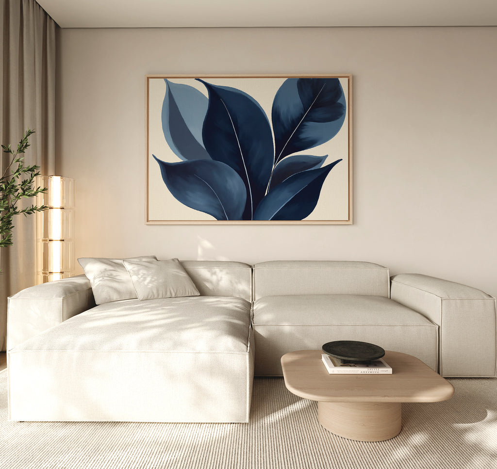 A modern living room features a light beige sectional sofa, low wooden coffee table, potted plant, and the Indigo Depths Canvas Art - Horizontal as elegant wall art on a neutral wall.
