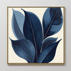 The Indigo Depths Canvas Art - Square features large, stylized blue leaves with white vein details on a light beige background, adding a bold yet serene Nordic touch to any white wall.