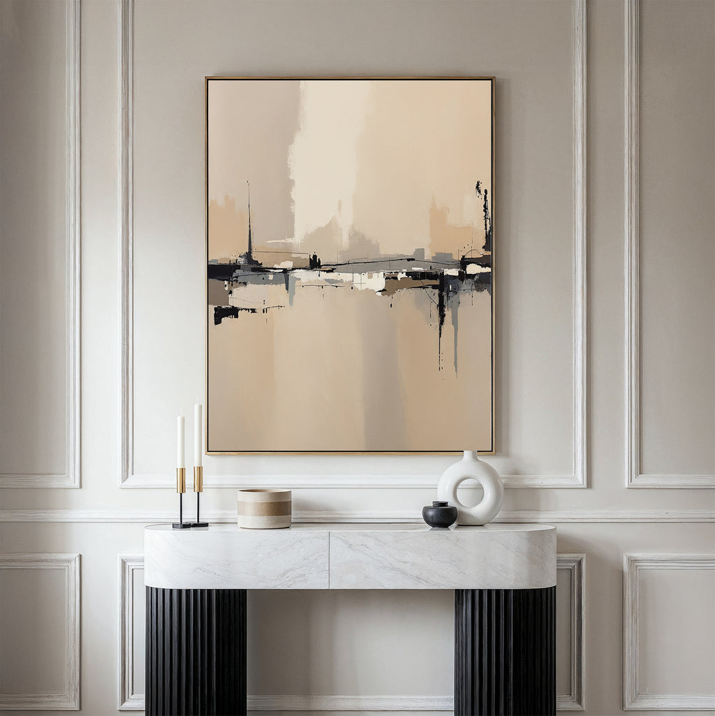A minimalist console table with modern decor stands against a creamy paneled wall, topped by the Industrial Cityscape Canvas Art - Vertical, whose abstract city design in neutral tones adds sophistication to the elegant space.