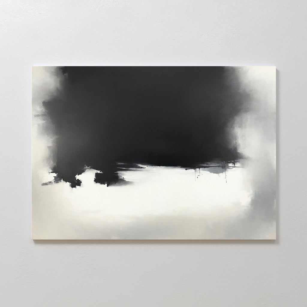 The Ink Cloud Formation Canvas Art - Horizontal features a dark black upper section blending into gray and white beneath, creating a sleek, modern look; this monochrome artwork is displayed on a light-colored wall.
