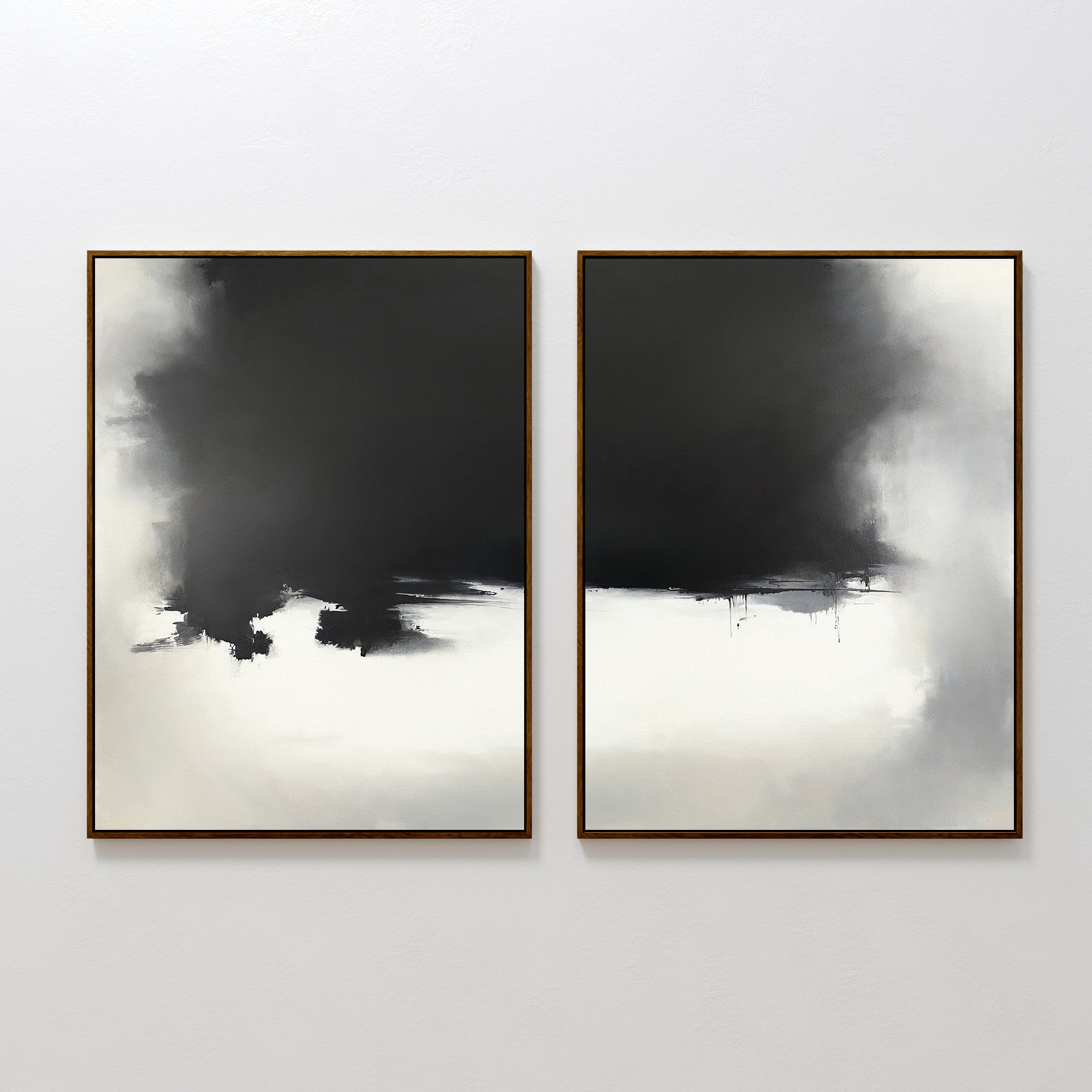The Ink Cloud Formation - Set Of 2 features abstract paintings in dark frames, each showcasing bold black and white brushstrokes that form dramatic, cloud-like shapes—perfect for adding striking modern monochrome style to your wall décor.
