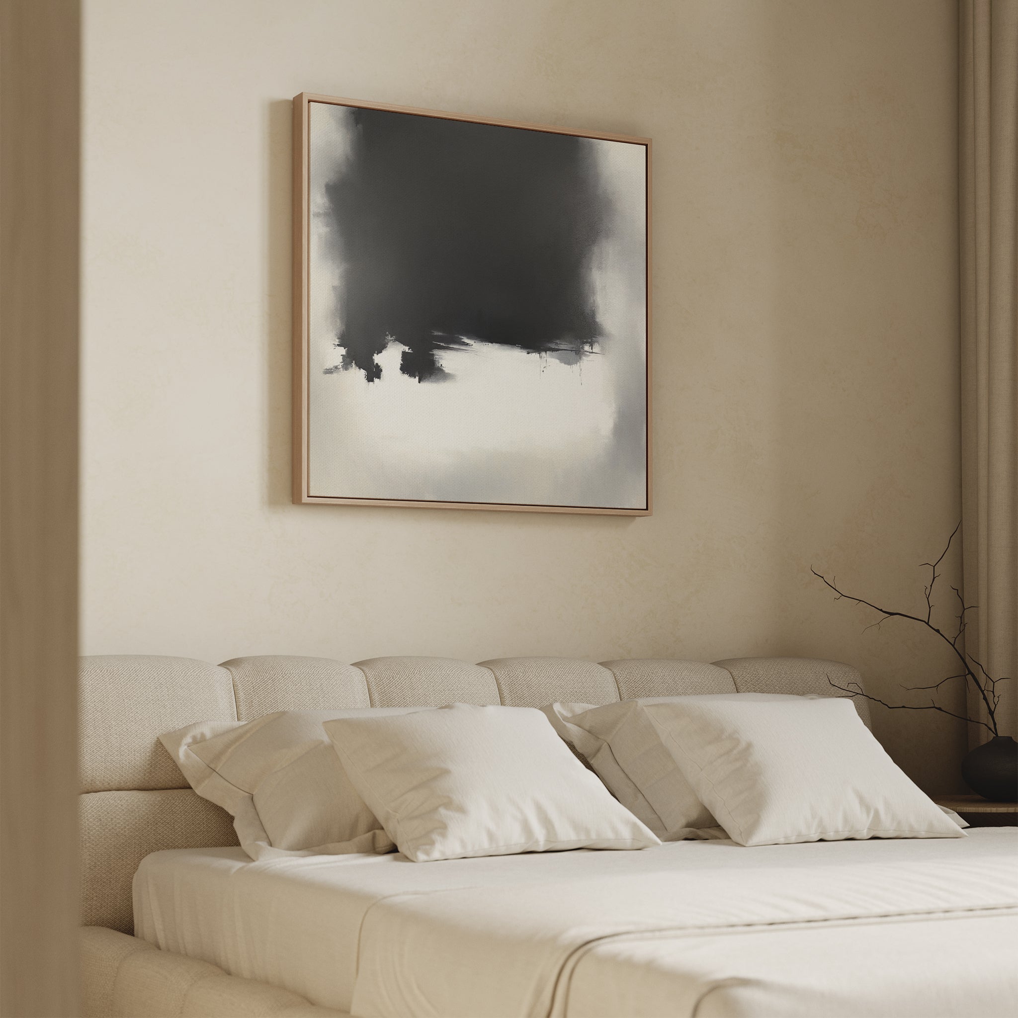 A minimal bedroom with a beige upholstered bed, cream bedding, and four pillows features the Ink Cloud Formation Canvas Art - Square above the headboard for modern flair. A bare branch sits on the right bedside table.
