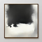 The Ink Cloud Formation Canvas Art - Square features a large, dark black and gray cloud-like shape blending into lighter tones at the bottom, framed in dark wood. This modern monochrome print exudes moody sophistication and atmospheric style.