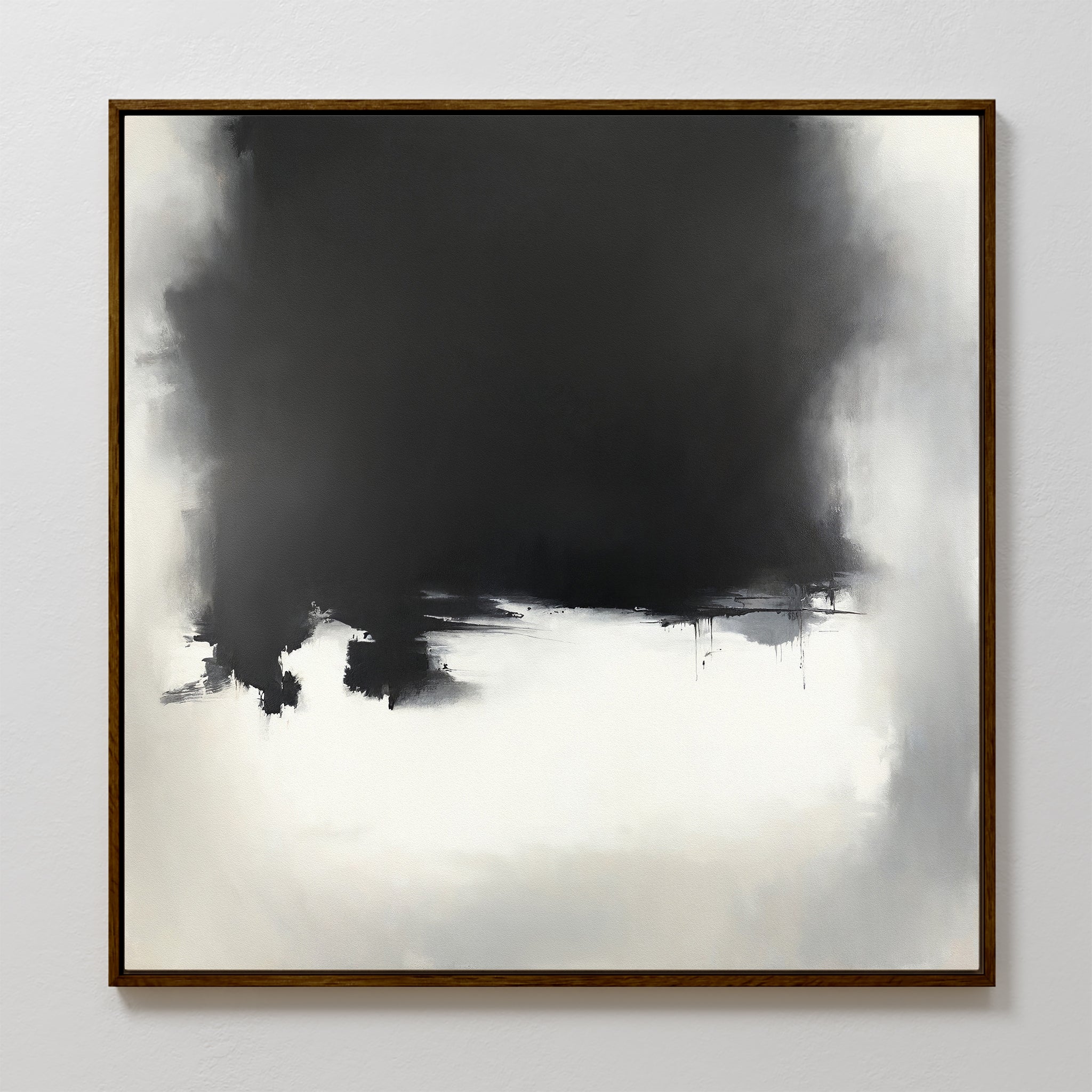 The Ink Cloud Formation Canvas Art - Square features a large, dark black and gray cloud-like shape blending into lighter tones at the bottom, framed in dark wood. This modern monochrome print exudes moody sophistication and atmospheric style.