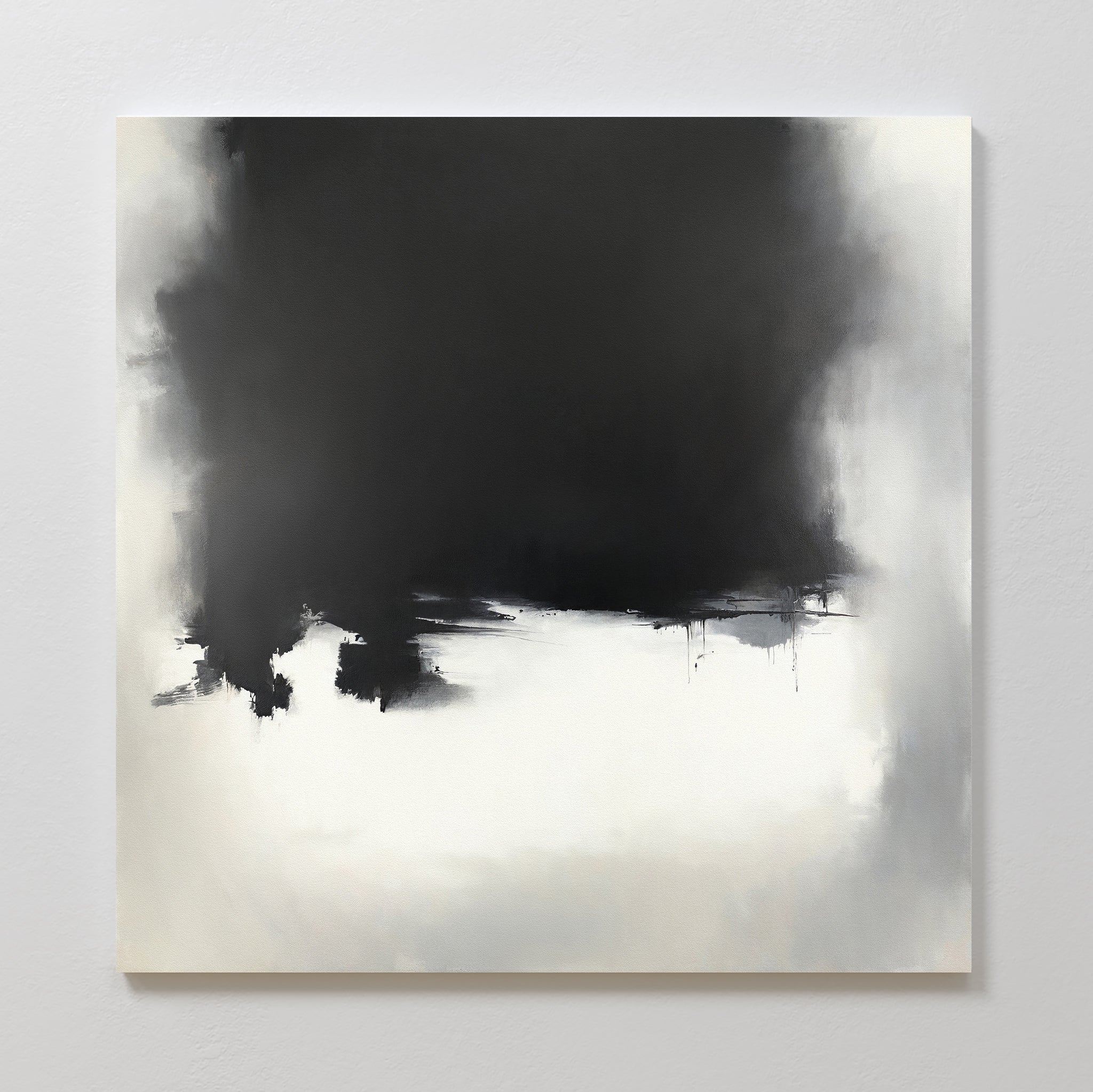 Ink Cloud Formation Canvas Art - Square showcases a bold black cloud dominating the upper center, fading into soft gray and white. This monochrome print adds modern sophistication with blurred transitions and subtle paint drips.